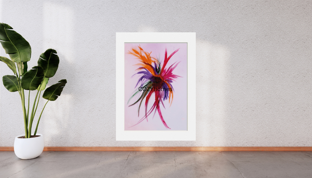 Framed abstract artwork on a wall next to a potted plant